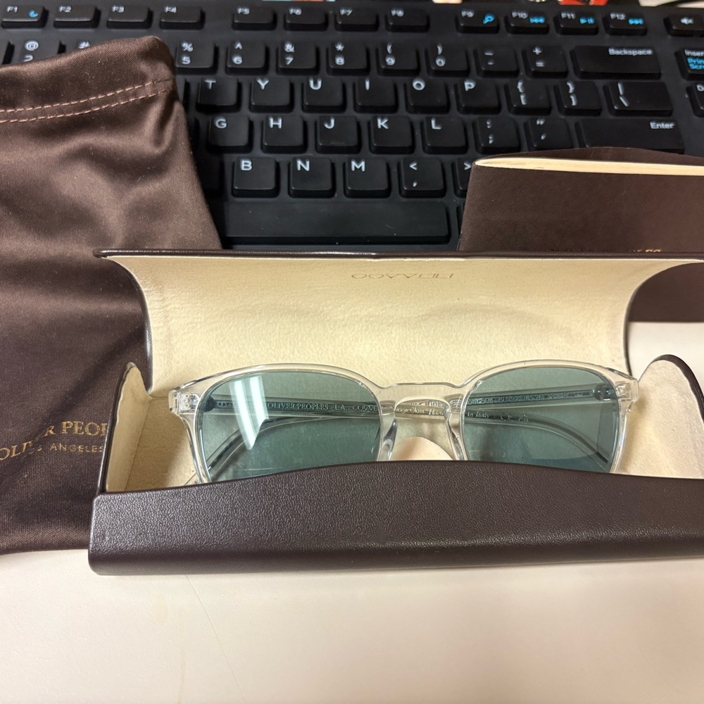 Oliver Peoples Transparent Frame with Green Lenses Sunglasses
